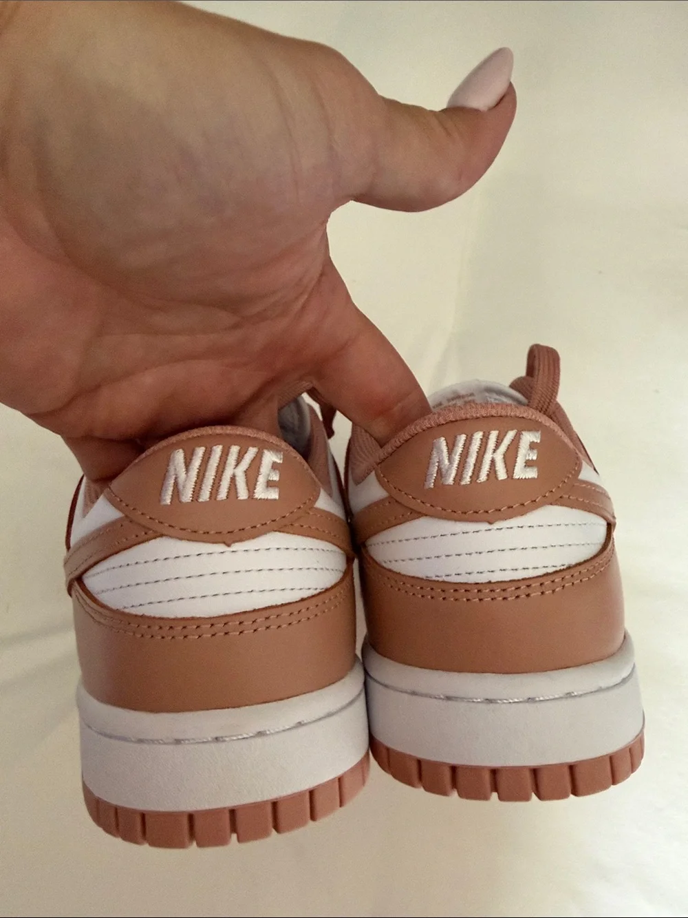 Nike Women's Low-Top Sneakers in White and blush
